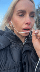 Woman speaks outdoors while wearing headphones in Strömstad