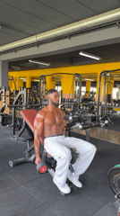 Man performs dumbbell workout at Paris gym
