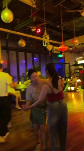 Afternoon dancing and socializing observed at Shanghai nightclub venue