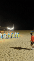 Night beach gathering with volleyball and entertainment in Quy Nhon