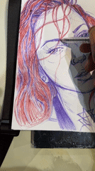 Artist sketches red-haired portrait in blue and red ink, Abuja
