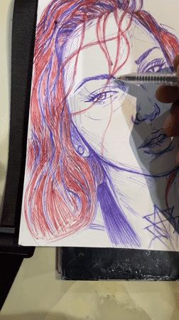 Artist sketches red-haired portrait in blue and red ink, Abuja