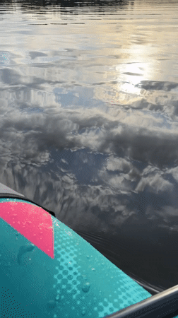Paddleboarder films serene lake scene in Chaykovsky, Russia