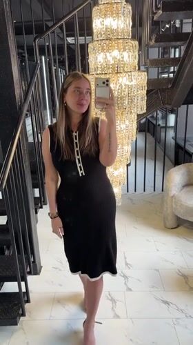 Woman takes selfies in upscale Shcherbinka interior