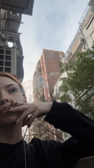 Person smoking on Buenos Aires balcony captured by witness
