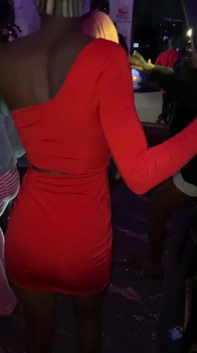 Nightclub party scene in Jos with dancing and colorful lighting