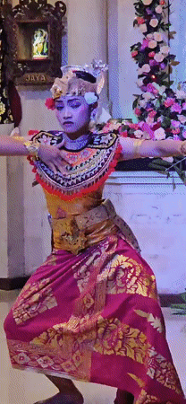 Traditional Balinese dancer performs in elaborate costume in Denpasar