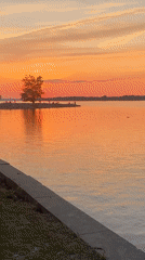 Ottawa River sunset with small island gathering