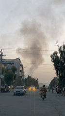 Heavy smoke rises over Kandahar in back-to-back street-level clips