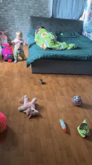 Child and person captured in domestic bedroom scene, Vesyoloye