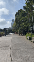 Daytime approach to Big Buddha statue documented in Karon