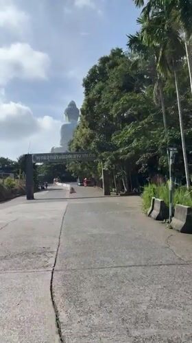 Daytime approach to Big Buddha statue documented in Karon