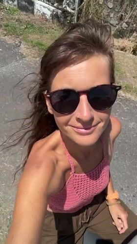 Woman films herself and rice terraces in Kediri