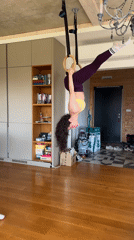 Woman practices inverted ring gymnastics in Tvarditsa home gym