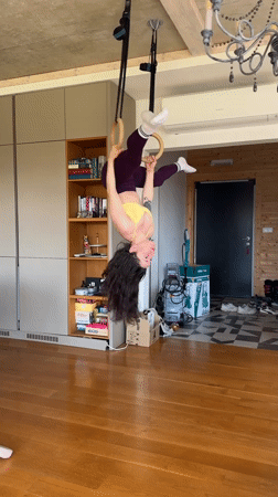 Woman practices inverted ring gymnastics in Tvarditsa home gym