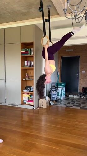 Woman practices inverted ring gymnastics in Tvarditsa home gym
