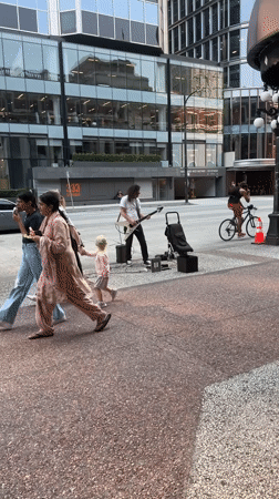 Gastown streets, rail yards, and a sidewalk guitarist in Vancouver