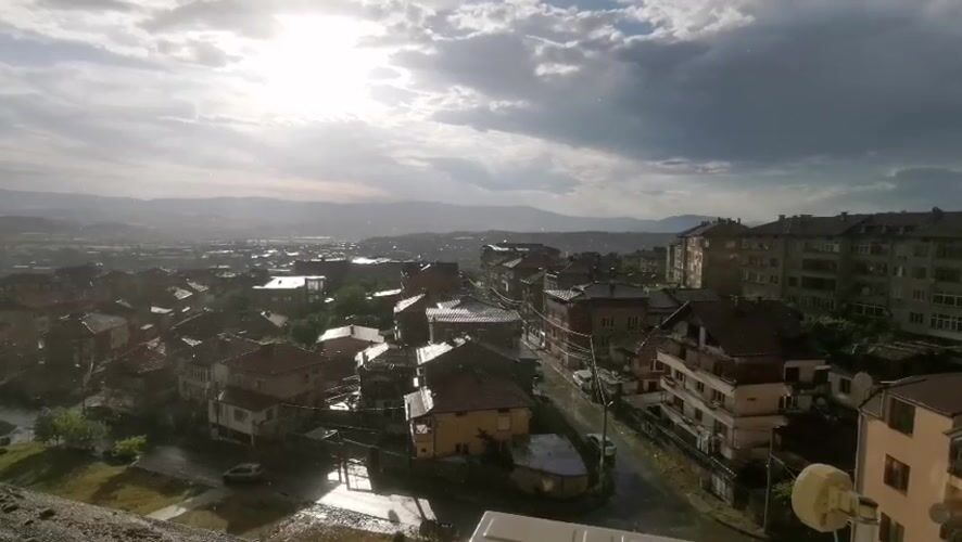 Post-rain sunlight illuminates Blagoevgrad urban landscape from elevated viewpoint