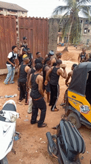 Young men gather on dusty streets in Onitsha, Nigeria