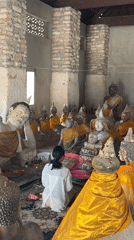 Temple visit in Baan Harn: offerings, statues, and sacred iconography