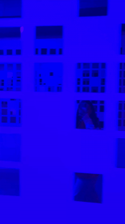 Grid-patterned wall filmed under blue lighting in Batumi