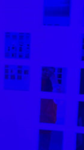Grid-patterned wall filmed under blue lighting in Batumi