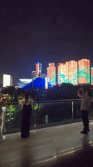 Crowds gather for nighttime light show in Shangcheng District