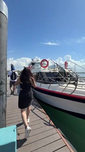 Sunny morning at a Denpasar harbor pier with docked boat