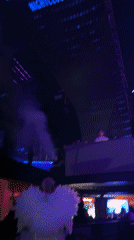 Late night club scene with costumed performer in Arica