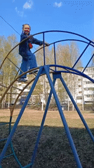 Families enjoy afternoon playground time in Noviy, Russia
