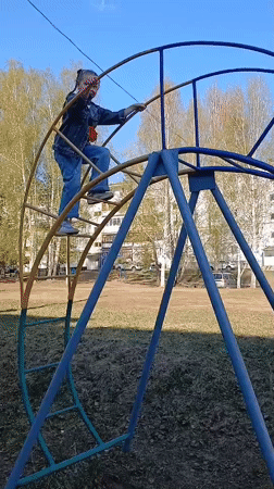 Families enjoy afternoon playground time in Noviy, Russia