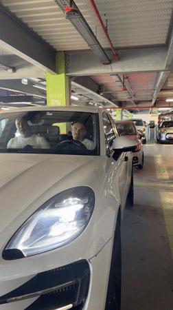 Two men observed in parked Porsche in French parking garage