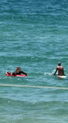 Morning beach activity and surfing session in Tel Aviv