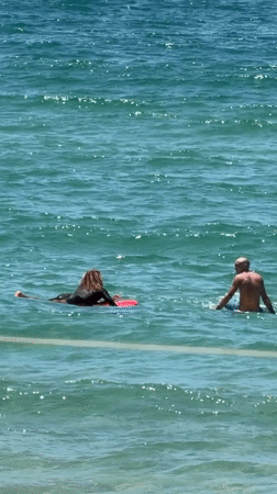Morning beach activity and surfing session in Tel Aviv