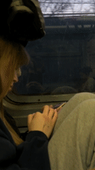 Train passenger uses phone during journey in Perm, Russia