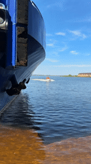Summer day in Chaikovsky: riverfront ship and fairground rides