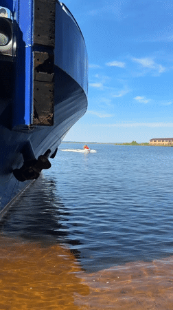 Summer day in Chaikovsky: riverfront ship and fairground rides