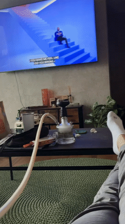 Person enjoys hookah session at home in Huixquilucan