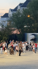 Couples dance in twilight at Yekaterinburg public square