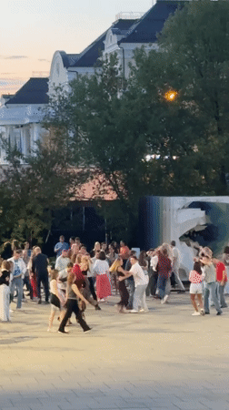 Couples dance in twilight at Yekaterinburg public square