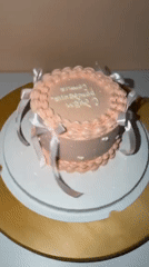 Pink decorated cake documented in Tel Aviv home setting