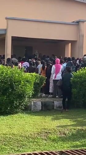 Large crowd gathers at Sasa Market building entrance