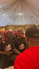 Traditional musicians perform in decorated tent in Jos, Nigeria