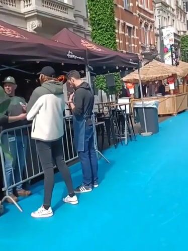 Street festival transforms Leuven road into blue-carpeted pedestrian market