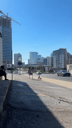 Nashville street corner, construction crane rising over the skyline