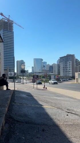 Nashville street corner, construction crane rising over the skyline