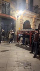 Late night street gatherings and club scenes documented in Sevilla
