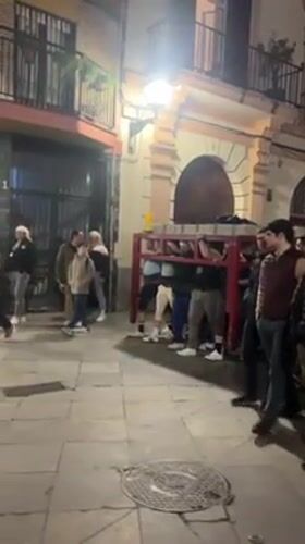 Late night street gatherings and club scenes documented in Sevilla
