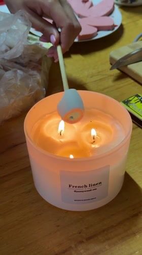 Woman toasts marshmallow over candle in Tashkent