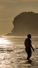 Morning beach walk captured at sunrise in Selemadeg, Indonesia